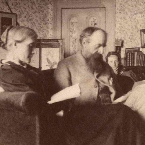 Julia and Leslie Stephen reading, Virginia in background, in the library at Talland House